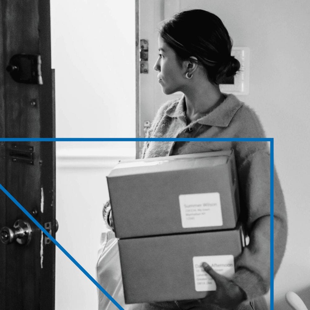 A woman holding boxes