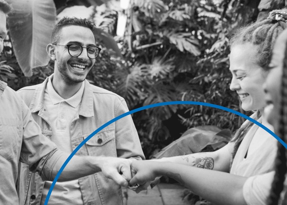 A group of people fist bump