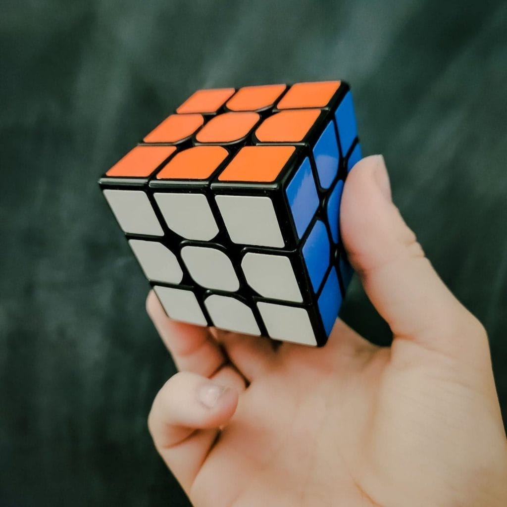 A right and holding Rubix cube puzzle