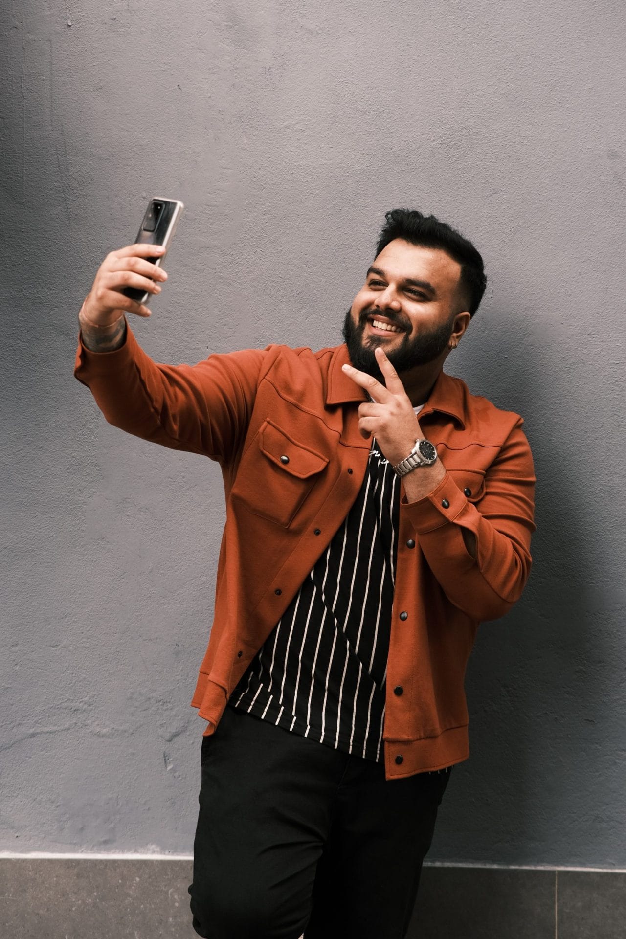 A workplace influencer takes a selfie